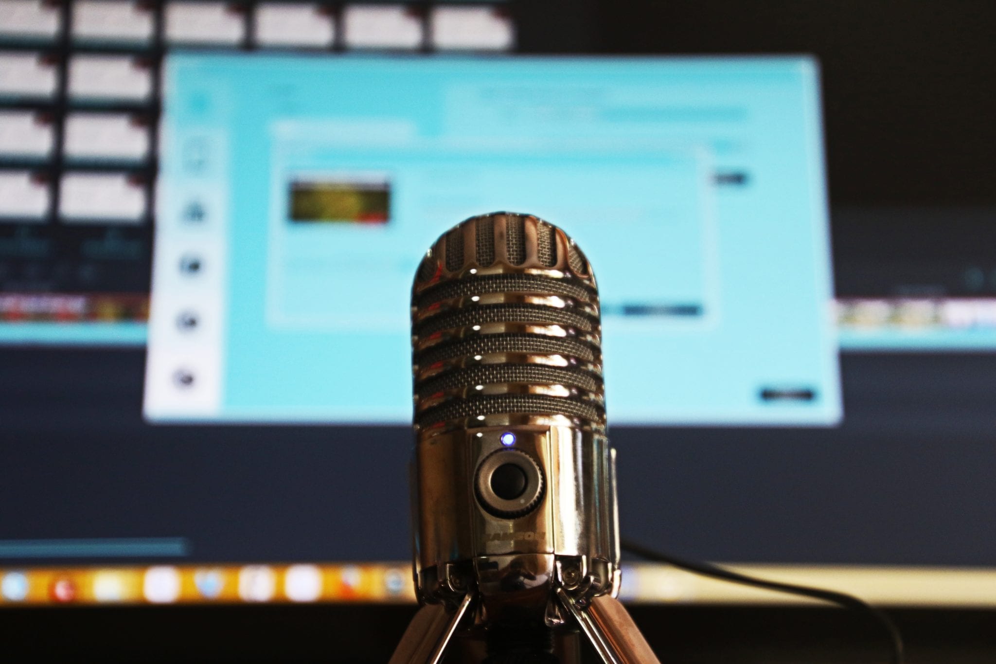 microphone in front of a computer monitor