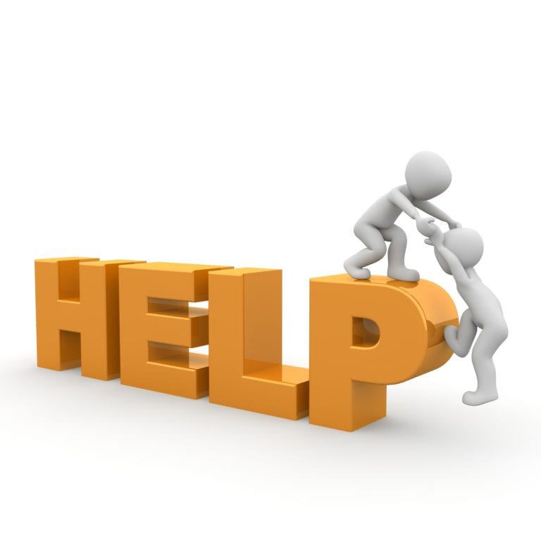 one person helping another person climb on top of the word help
